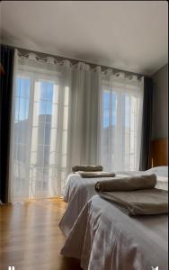 Postel nebo postele na pokoji v ubytování Hotel Rubin