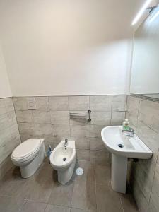 a bathroom with a toilet and a sink at Angel's Home in Somma Vesuviana