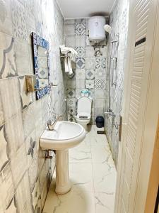 a bathroom with a sink and a toilet at White House in Aswan +29 photos