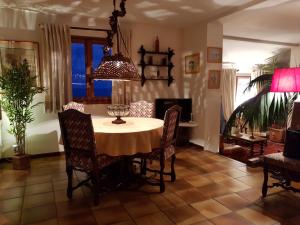 a dining room with a table and chairs at Villa St Michel in Brando