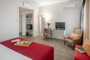 TV a/nebo společenská místnost v ubytování Hotel Estacão - Braga