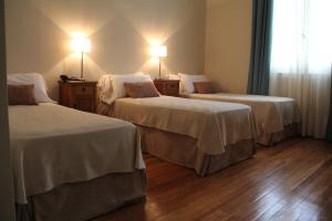 Ένα ή περισσότερα κρεβάτια σε δωμάτιο στο Hotel Termas Rosario de la Frontera +40 φωτογραφίες