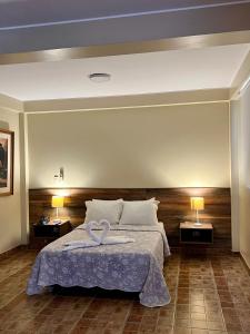 Cama ou camas em um quarto em Hotel El Huacachinero
