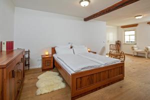 a bedroom with a large wooden bed in a room at Luxuriöse Sandstein Villa - 320 qm - 7 Räume in Dresden