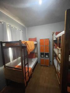 a room with two bunk beds and a closet at Hostel do atleta in Belo Horizonte