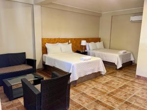Cama ou camas em um quarto em Hotel El Huacachinero