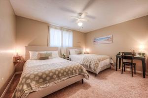 a bedroom with two beds and a desk in it at 45 per Off Monthly Stay - 7 Beds - BBQ in Kitchener