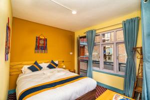 Voodi või voodid majutusasutuse Kwabahal Garden Hostel toas