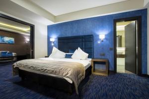 Ένα ή περισσότερα κρεβάτια σε δωμάτιο στο Apartments by Old Town Hotel