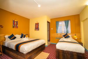Voodi või voodid majutusasutuse Kwabahal Garden Hostel toas