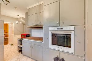 a kitchen with white cabinets and an oven at Wilson Family Home Walk to Community Rec Center! in Wilson