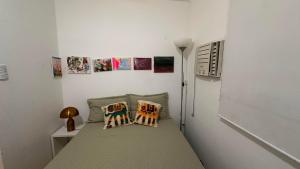 Een bed of bedden in een kamer bij Praia de Ipanema