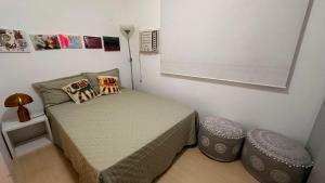 Een bed of bedden in een kamer bij Praia de Ipanema