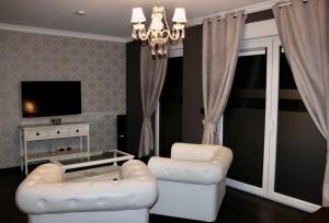 TV a/nebo společenská místnost v ubytování V E R O N E - Rooms & Suites - Liège - Rocourt