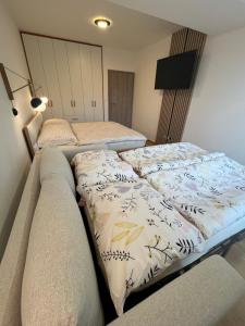 Postel nebo postele na pokoji v ubytování Slunečný apartmán