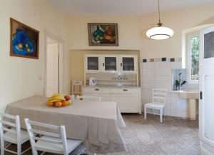 a kitchen with a table with a bowl of fruit on it at Gianina Apartment in Split