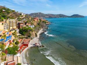 an aerial view of a beach and the ocean at Villas Kaukan by Tasman in Zihuatanejo
