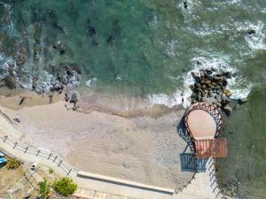an aerial view of a roller coaster on a beach at Villas Kaukan by Tasman in Zihuatanejo