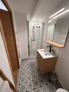 a bathroom with a sink and a shower at chalet cosy - Vallée Verte in Fillinges +13 photos