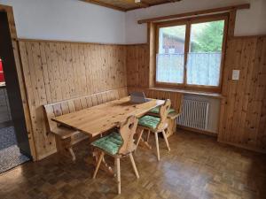 a wooden table in a room with a laptop on it at Charming Louisa in Rueras