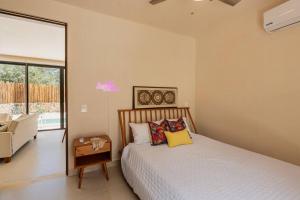 Ένα ή περισσότερα κρεβάτια σε δωμάτιο στο Close to Cenotes Private Pool 24hr Hr Security Gym Yoga Villa +18 φωτογραφίες