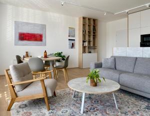 a living room with a couch and a table at Byt K21 Na Perštýně in Liberec