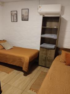 Giường trong phòng chung tại Lugar tranquilo