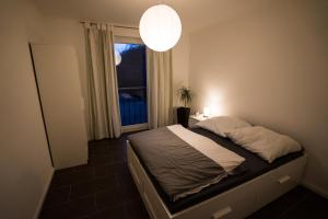 En eller flere senge i et værelse på Gästehaus am Paradieshof