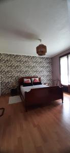 a bedroom with a large bed in a room at Maison familiale à Gerde in Gerde