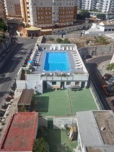 an overhead view of a swimming pool in a building at Gibraltar Sun Poolside Escape in Gibraltar