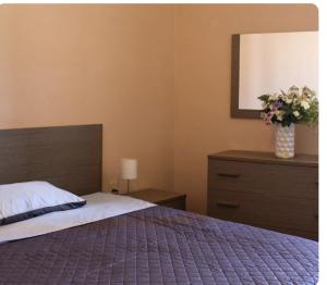 Postel nebo postele na pokoji v ubytování La Divina guest house