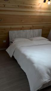 Postel nebo postele na pokoji v ubytování A-frame Muchia Scortii
