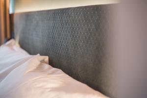 Postel nebo postele na pokoji v ubytování JUNGLE No5 Boutique Hotel - Stuttgart City-Center
