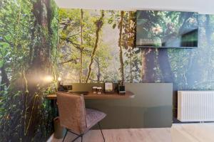 TV a/nebo společenská místnost v ubytování JUNGLE No5 Boutique Hotel - Stuttgart City-Center