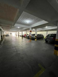 an empty parking garage with cars parked in it at Big Hotel Florianópolis in Florianópolis