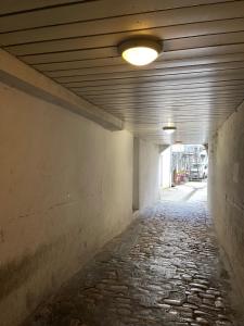 an empty hallway with a light on the ceiling at Studio centre-ville in Besançon