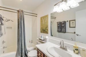 a bathroom with a sink and a toilet and a shower at Walk to Ski Lifts Cozy Crested Butte Condo in Crested Butte