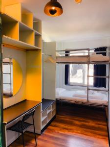 a room with two bunk beds and a desk at Copenhagen Downtown Hostel in Copenhagen