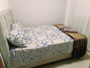 a bed in a room with at Para Família - privacidade e lazer próximo ao lago de Itaipu in Foz do Iguaçu +11 photos