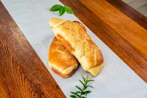 two croissants sitting on a napkin on a table at Pousada Ponta da Baleia in Barra Grande