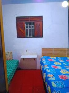 Ένα ή περισσότερα κρεβάτια σε δωμάτιο στο Casa de praia