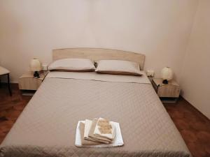 Postel nebo postele na pokoji v ubytování La Divina guest house