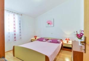 Postel nebo postele na pokoji v ubytování Apartment Kosta