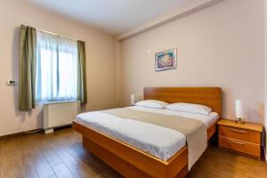 Ένα ή περισσότερα κρεβάτια σε δωμάτιο στο Apartments Frajona