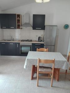Kuchyň nebo kuchyňský kout v ubytování Apartment Kosta