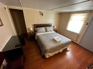Giường trong phòng chung tại Hostal Sevilla Temuco