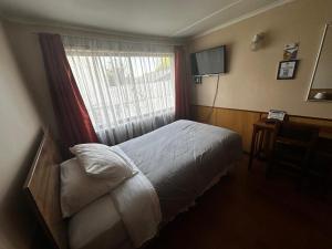 Giường trong phòng chung tại Hostal Sevilla Temuco