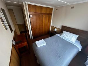 Giường trong phòng chung tại Hostal Sevilla Temuco