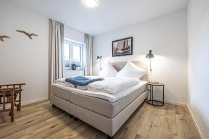 Postel nebo postele na pokoji v ubytování Schlei-Koje 1