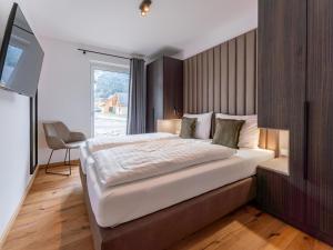 A bed or beds in a room at Mountain Chalet Arnica